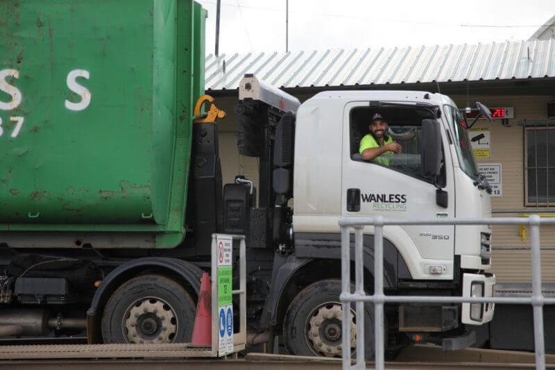 Wanless waste management truck and the drivers